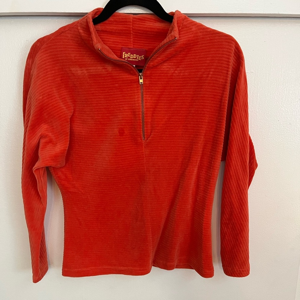 Freddie’s of Pinewood orange velvet batwing top with zipper.
